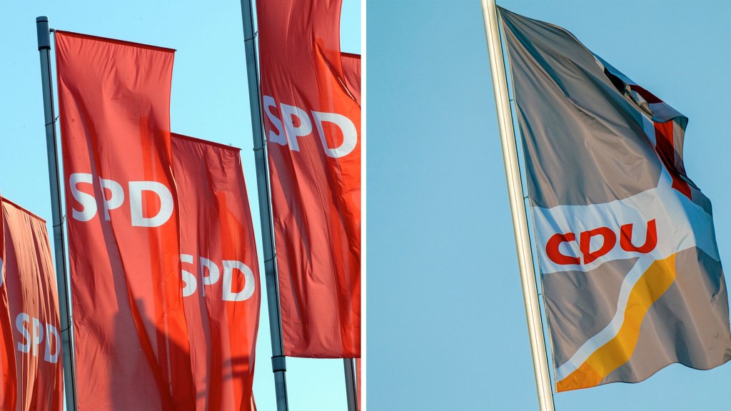 Foto: Mehrere Parteiflaggen der SPD neben einer der CDU (Foto: picture alliance/dpa)