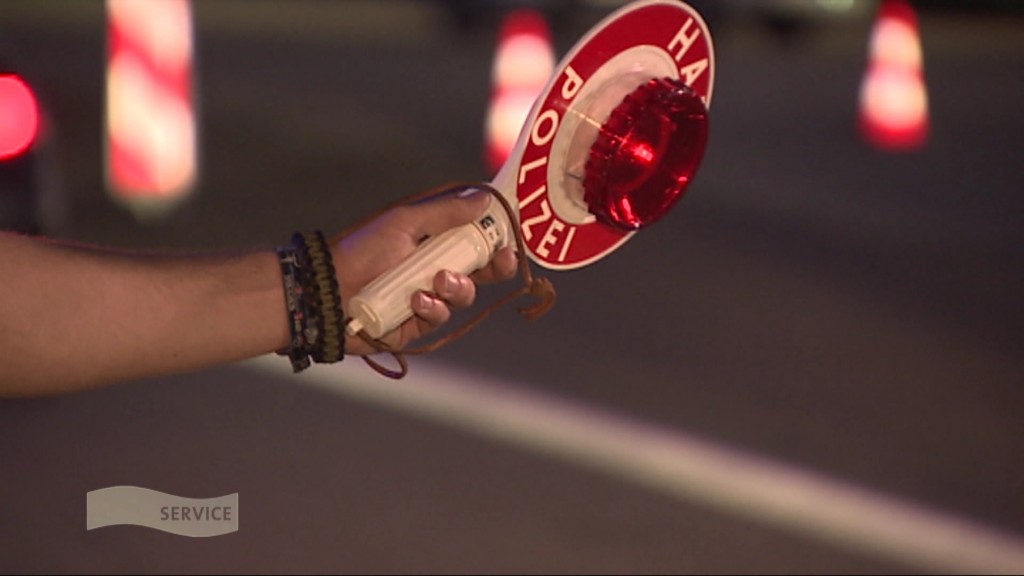 Foto: Polizeikelle in einer Hand