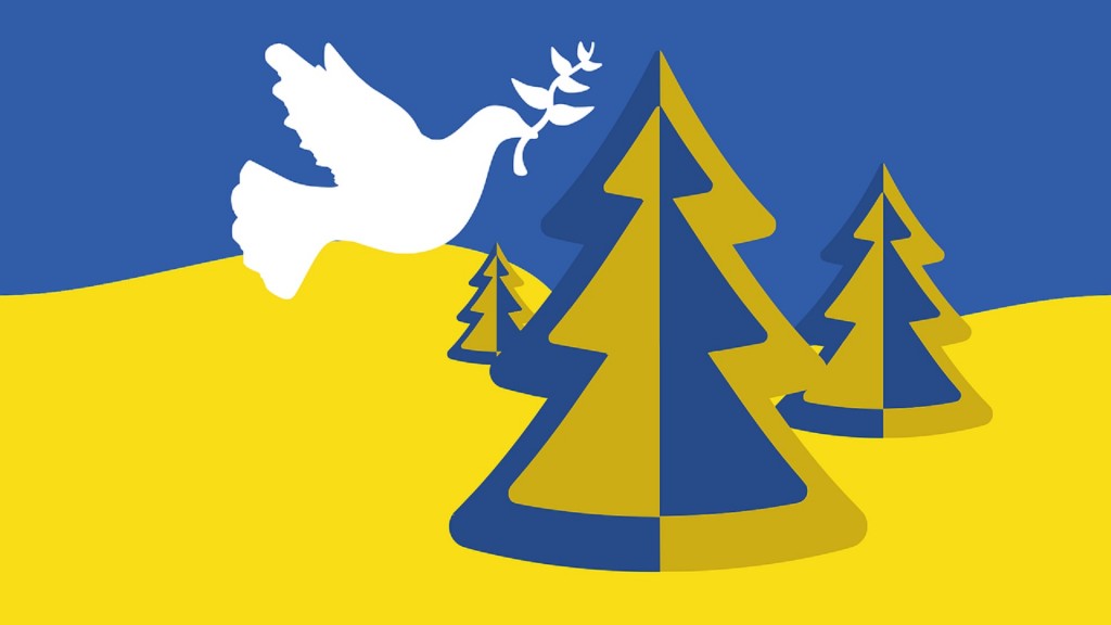 Eine Friedenstaube und Weihnachtsbäume in den ukrainischen Farben 