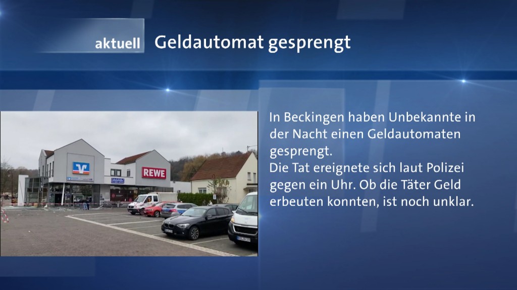 Foto: Sicht auf gesprengten Geldautomaten neben Texttafel