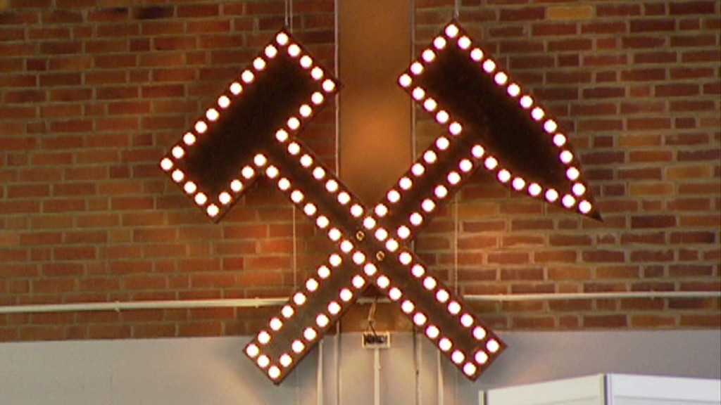 Schlägel und Eisen als beleuchtet Symbol des Bergbaus
