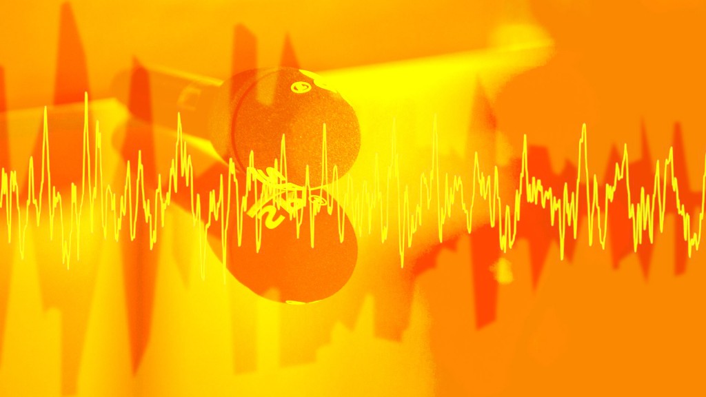 Die Ausschläge von Tönen vor einem Mikrofon und gelb-orangem Hintergrund