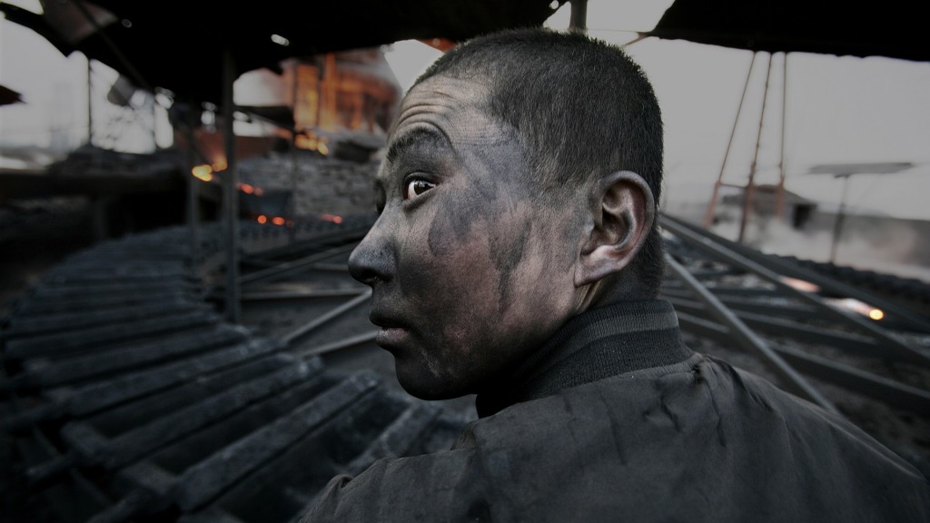 Lu Guang, Worker in a small smeltering factory, Wuhai City, Inner Mongolia, 2005