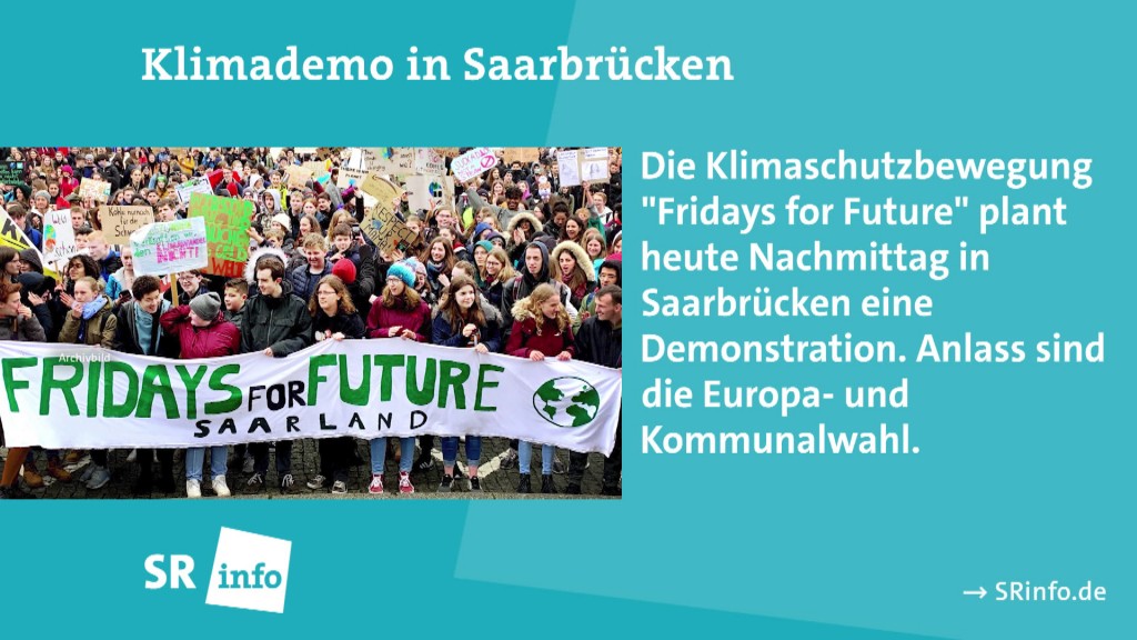 Foto: Klimademo in Saarbrücken neben Texttafel