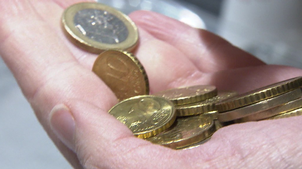 Foto: Geldmünzen in einer Hand