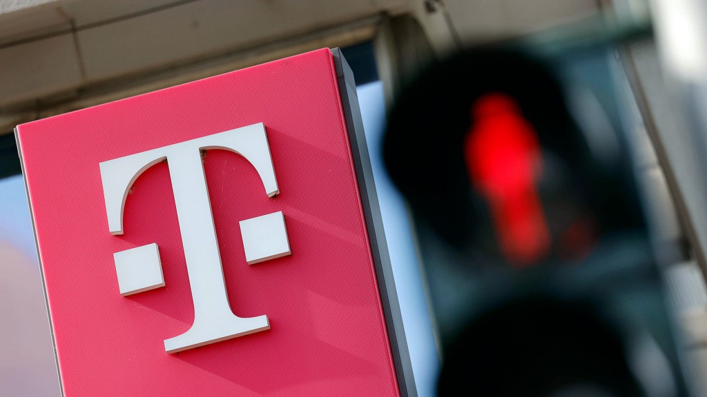 Foto: Telekom-Logo neben einer roten Fußgänger-Ampel