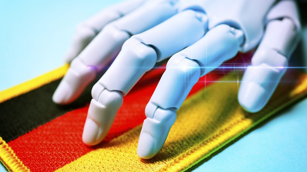 Foto: Künstliche Intelligenz: Roboterhand auf einer Deutschlandfahne (Symbolbild)